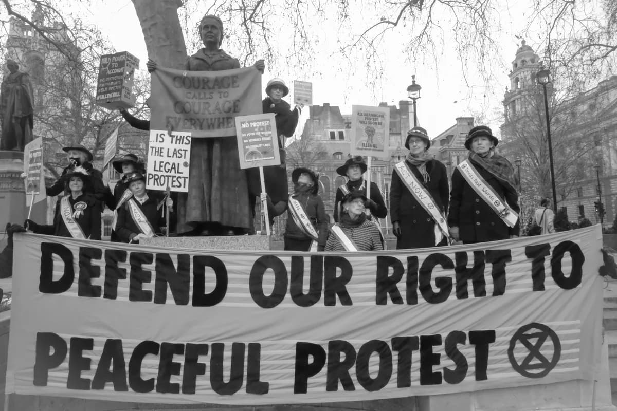 People carrying placards at a protest in London in January 2022